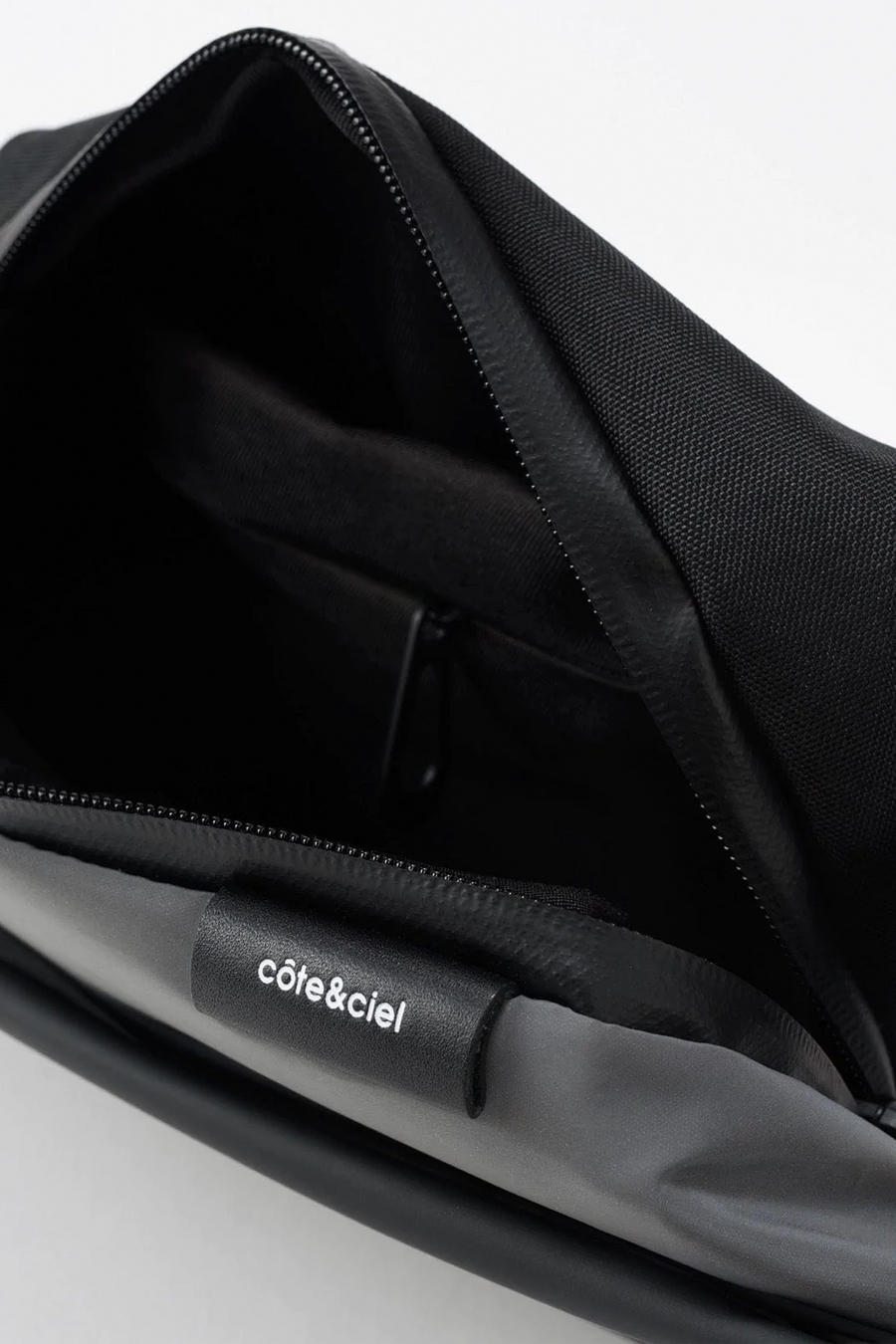 Buy the Cote & Ciel Isarau Cross Body Small Reflective in Black at Intro. Spend £50 for free UK delivery. Official stockists. We ship worldwide.